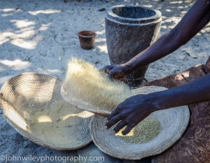"Mahangu" or millet being sifted before grinding