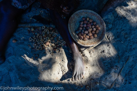 Still life with a womans's foot as she sorted mangetti nuts